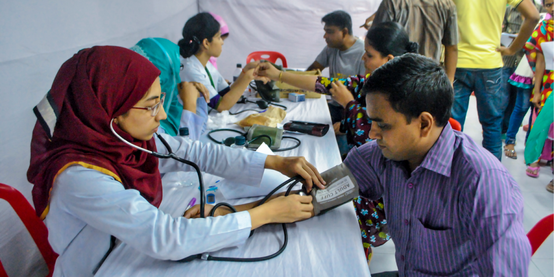 Blood pressure being tested in a health camp 