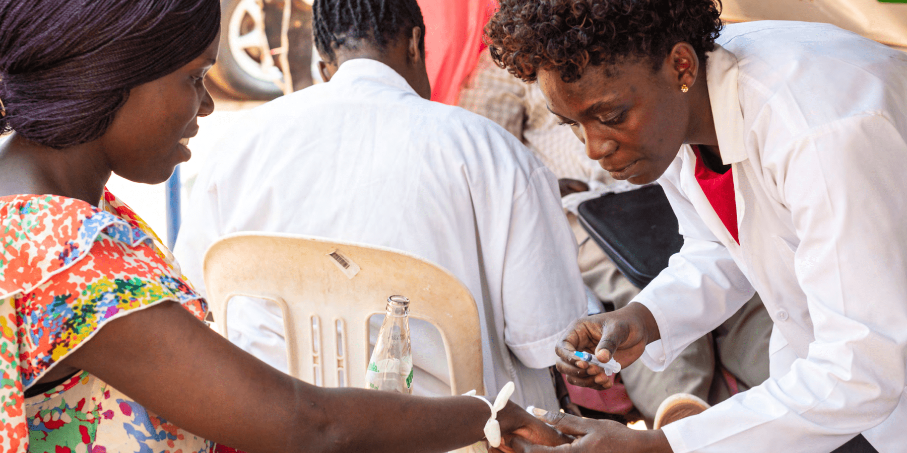 A woman donates blood at a blood donation street point in Kampala, Uganda.