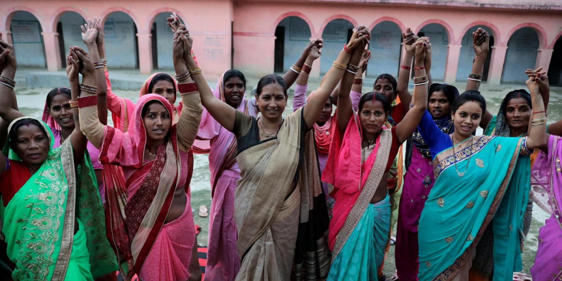 Elected Women Representatives in India hold their hands
