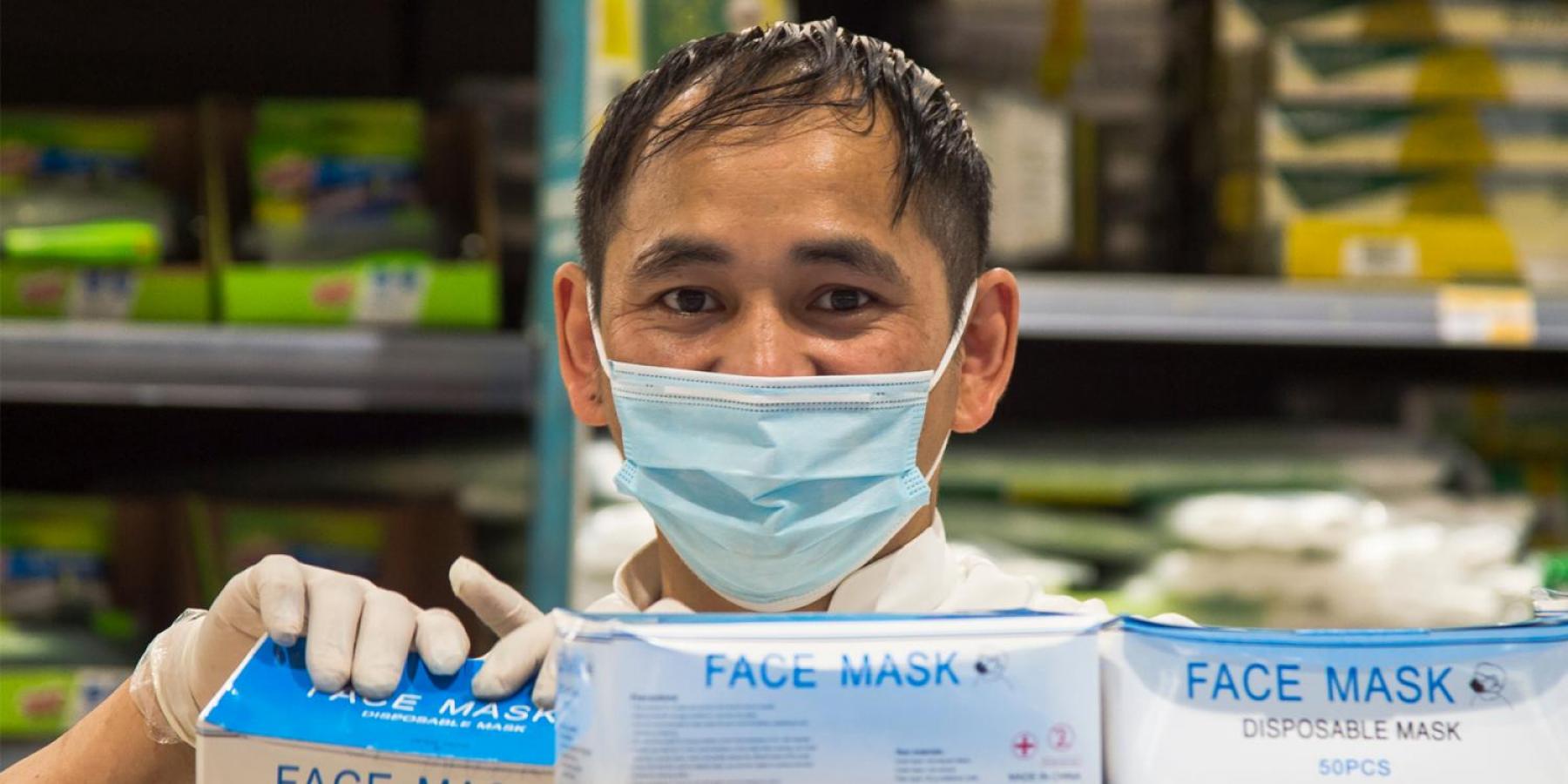 Man in pharmacy with face masks