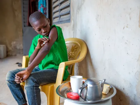 A boy manages his diabetes in Uganda, still from the Facing Forward series