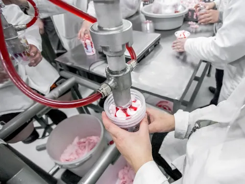 Industrial ice cream being made at a food processing plant 
