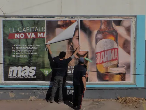 Alcohol advertising being replaced with electoral propaganda in the street in Argentina 