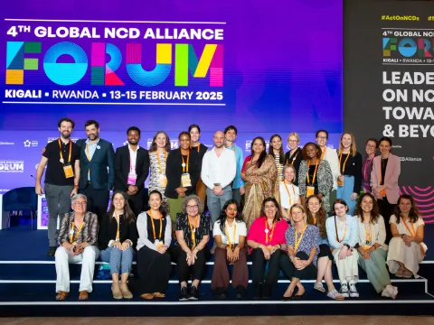 ncd alliance team smiling on stage at the global ncd alliance forum