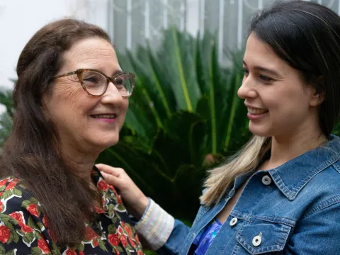 Woman living with cancer smiling with her daughter in Paraguay