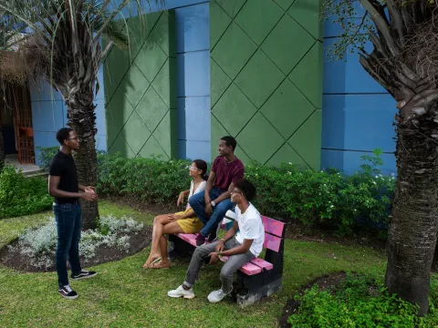 Pierre Cooke Jnr speaking to group of youth