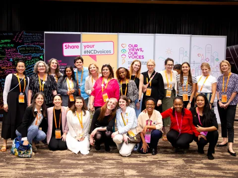 ncda colleagues standing in front of community zone at Global Forum 2025