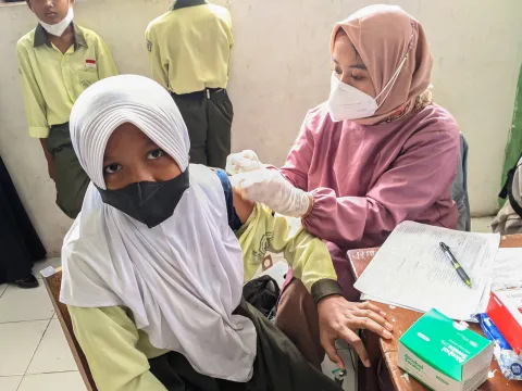 Student being vaccinated in south east asia