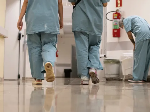 hospital health workers walking in scrubs