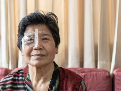 Asian old senior woman having eye care treatment on Age-related eye diseases.