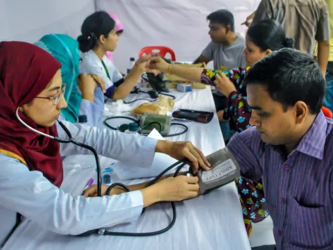 Blood pressure being tested in a health camp 