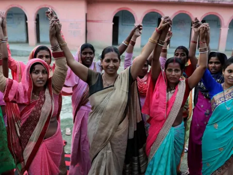 Elected Women Representatives in India hold their hands