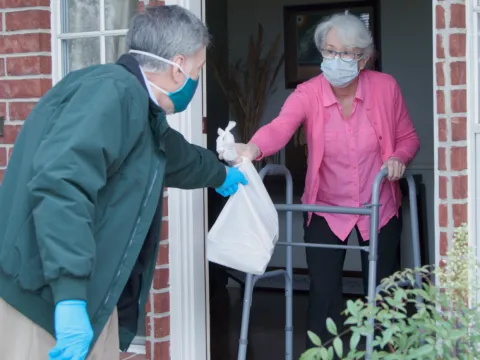 Woman getting groceries during COVID-19