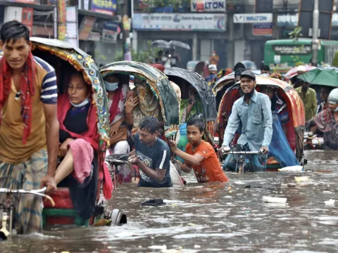 People in Asia moving through flood caused by Tsunami