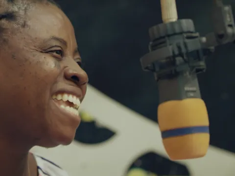 Martha Coffie, Vice President, Mental Health Society of Ghana. she speaks at a local radio station as part of the mini-film 'Stopping the Stigma'.