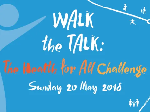 Photo of people wearing Health for All / Walk the Talk T-shirts jumping in the air