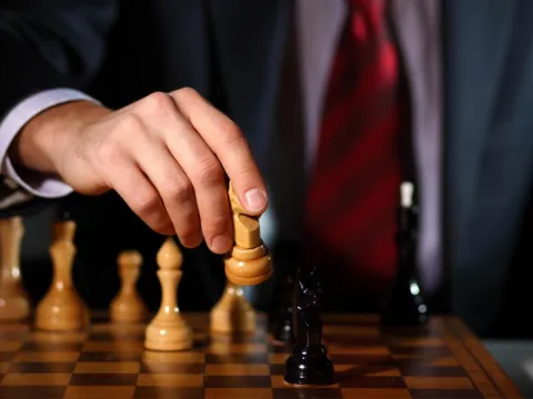 Business tactics playing chess