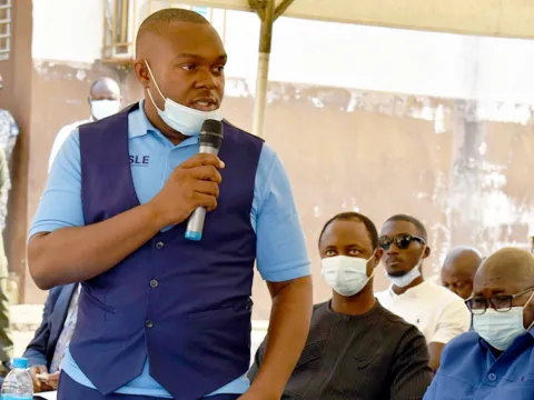 Jothan Johnson,  lived experience of multiple chronic conditions, delivering a speech at the opening of the Stroke Ward Sierra Leone