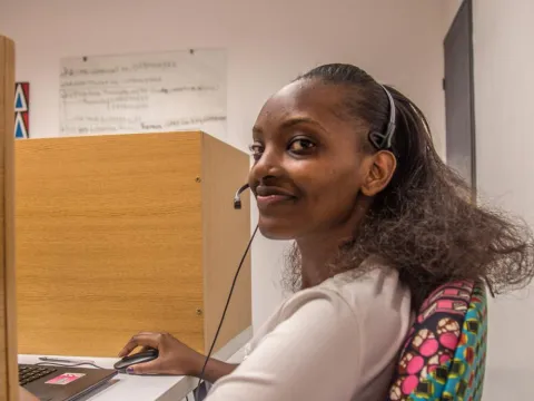 Woman working at computer smiling