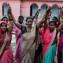 Elected Women Representatives in India hold their hands
