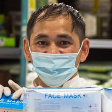 Man in pharmacy with face masks