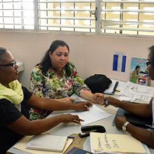 Patients speak with a health professional at an integrated care clinic in the Dominican Republic.