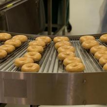 Image of production line with doughuts