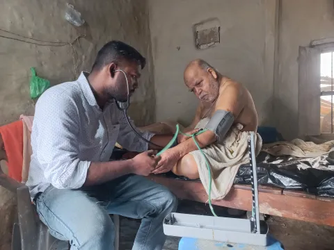 Doctor visiting a low-resource patient with CVD in his house in Bangladesh