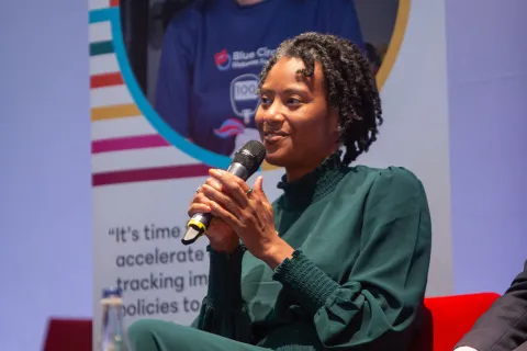 loyce pace at ncd alliance event talking on stage 