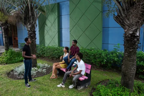 Pierre Cooke Jnr speaking to group of youth