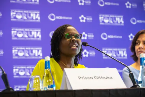 kenyan woman speaking into microphone at press conference