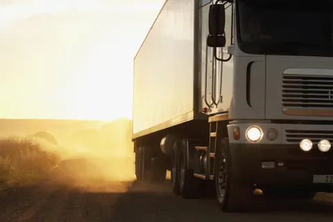 Truck driving on dirt road