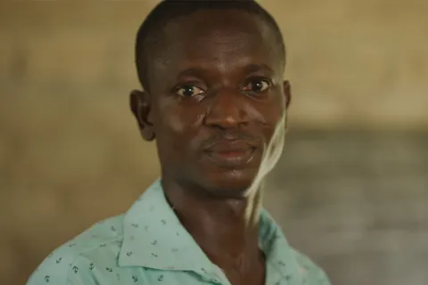 Potrait of a man looking into camera.