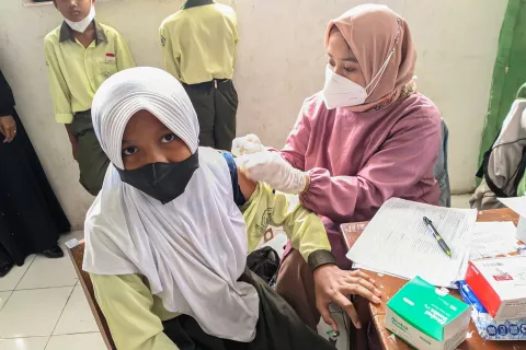 Student being vaccinated in south east asia