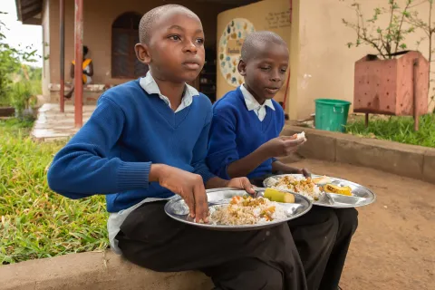 Children eating at a school in Tanzania