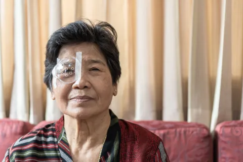 Asian old senior woman having eye care treatment on Age-related eye diseases.