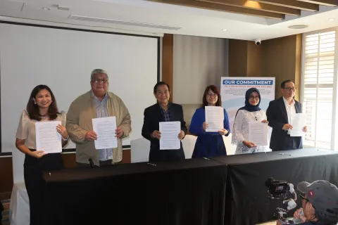 HWPA members affirm their commitment on NCD action through a signing ceremony.