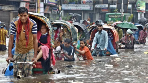 People in Asia moving through flood caused by Tsunami