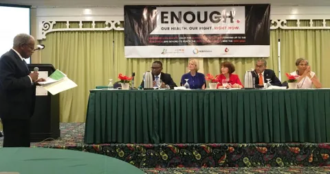 NCD Alliance Board member and Director Emeritus at PAHO, Sir George Alleyen, left, speaking at the Caribbean NCD Forum