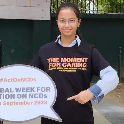 Healthy India Alliance advocate with Global Week for Action on NCDs cardboard bubble
