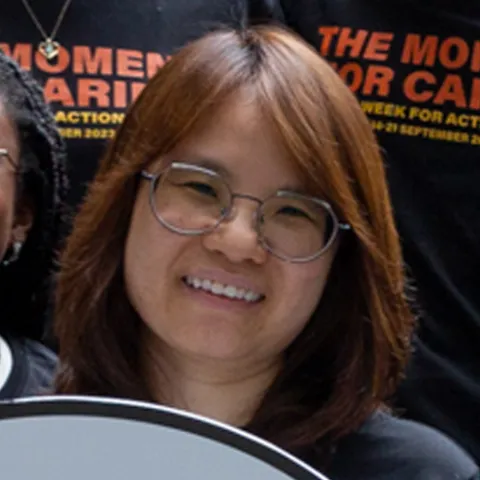 Malaysian woman smiling at camera