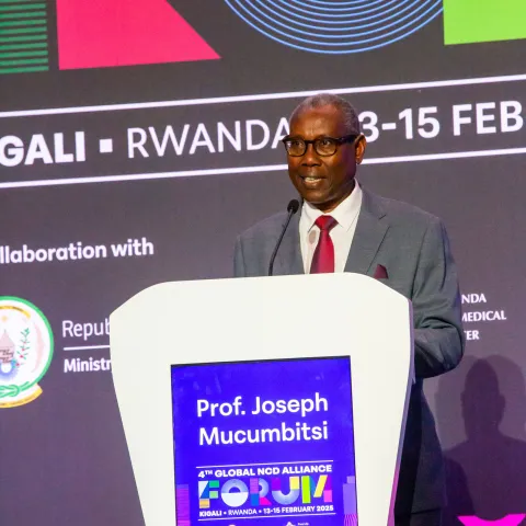 Rwanda NCD Alliance President Joseph Mucumbutsi on stage talking at Global NCD Alliance Forum