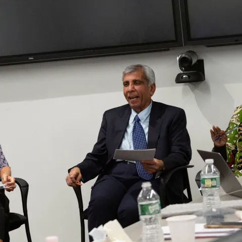 Tanzanian Man, Dr Kaushik, smiling during NCDA meeting