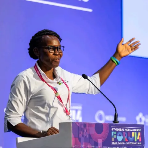 Harriet Abeda speaking at the 2025 Global NCD Alliance Forum in Kigali, Rwanda. 