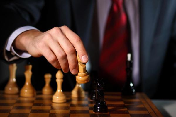 Business tactics playing chess